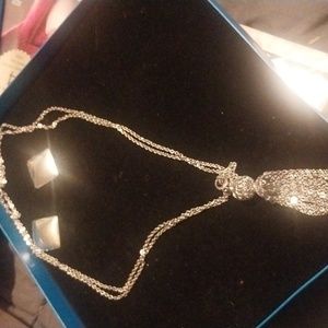 silver necklace with silver earrings